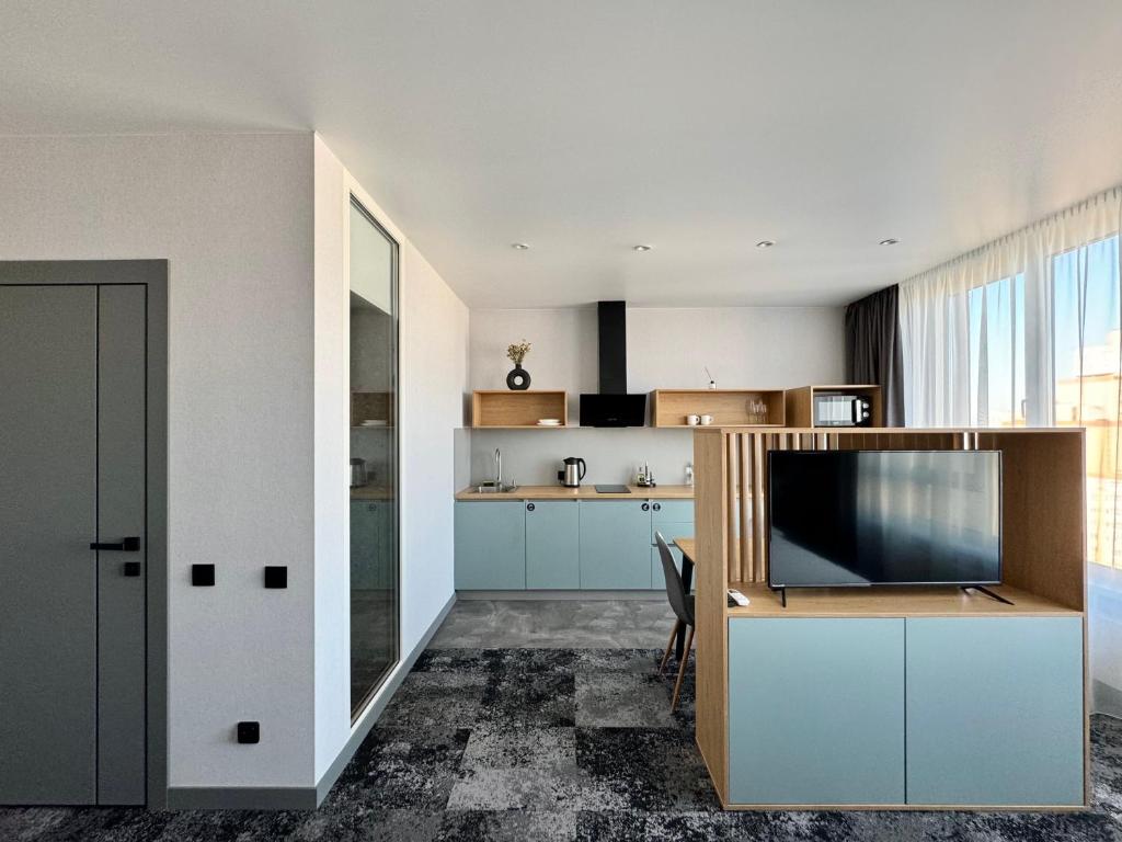 TV a/nebo společenská místnost v ubytování Be The One Hotel