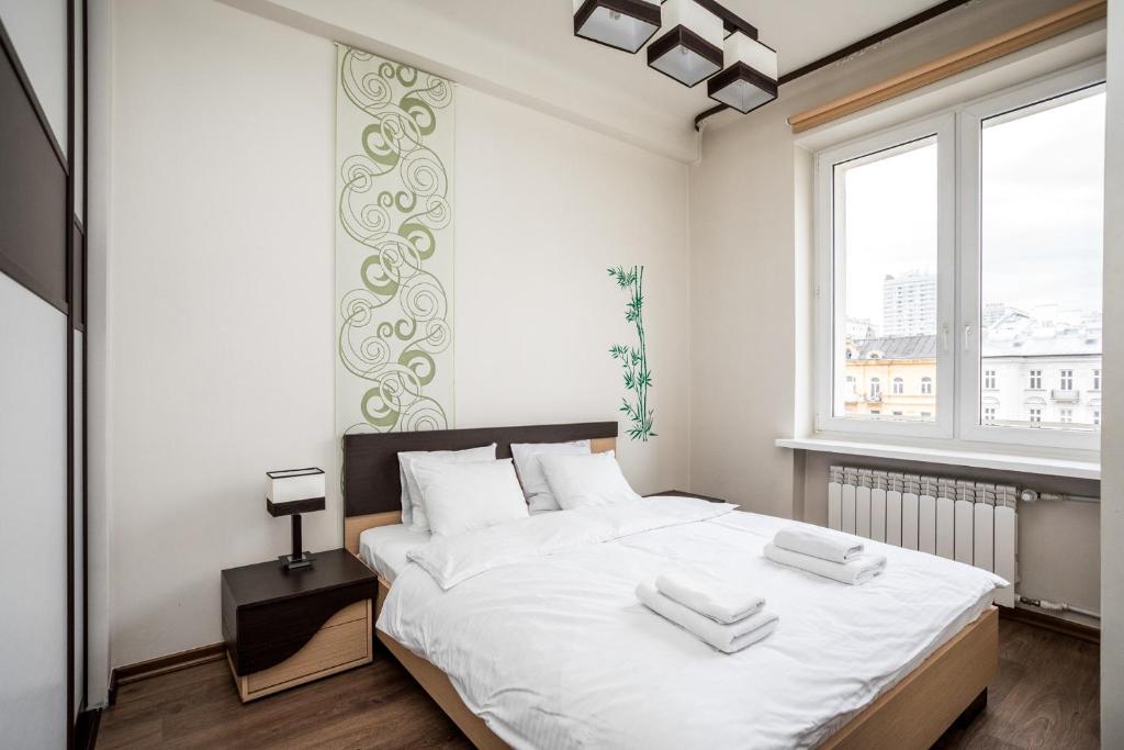 Posteľ alebo postele v izbe v ubytovaní Apartamenty Wawa Centrum by Your Freedom