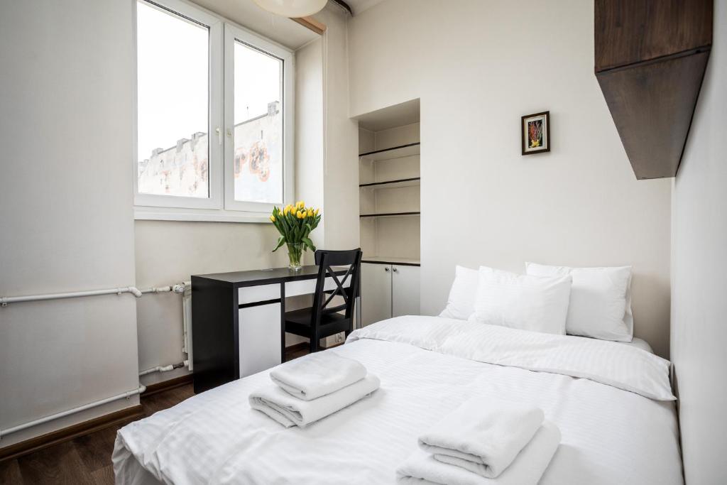 Posteľ alebo postele v izbe v ubytovaní Apartamenty Wawa Centrum by Your Freedom