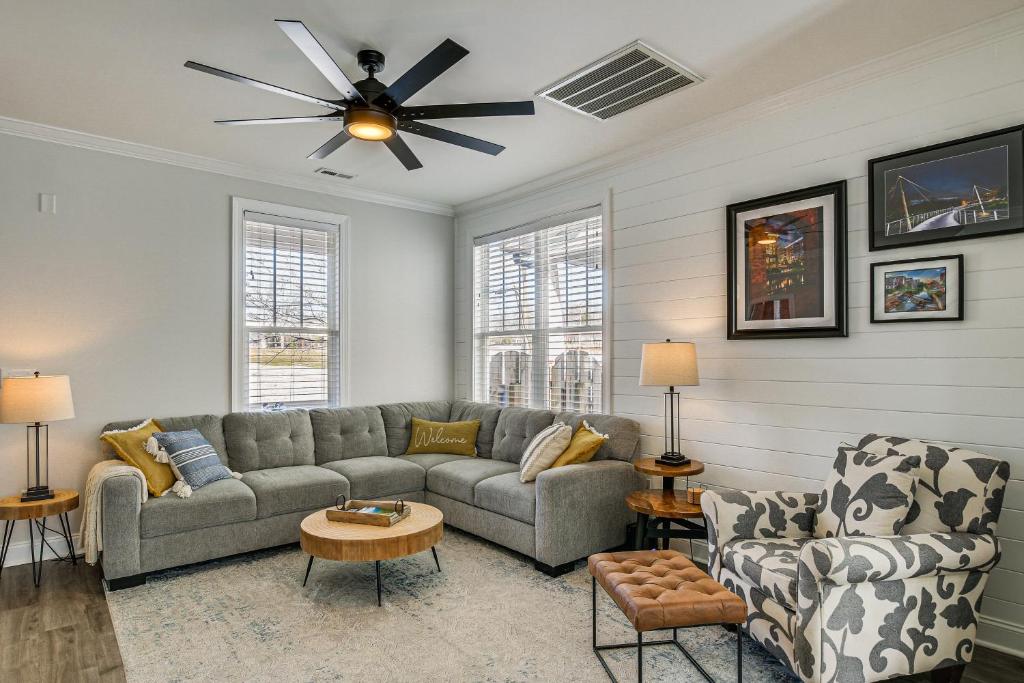 a living room with a couch and a ceiling fan at Updated Greenville Home with Deck about 1 Mi to Downtown in Greenville