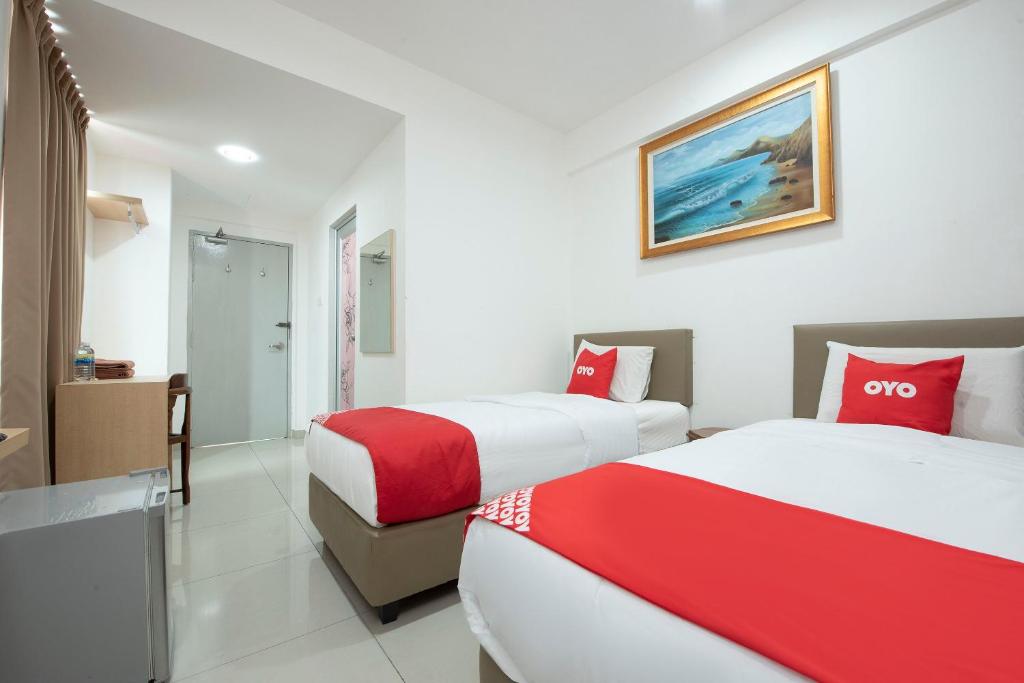 Postel nebo postele na pokoji v ubytování Sg Rengit City Resort 3