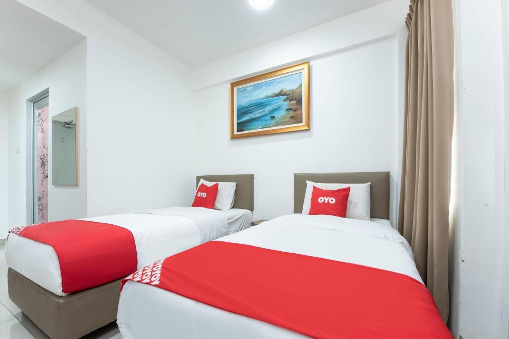 Postel nebo postele na pokoji v ubytování Sg Rengit City Resort 3
