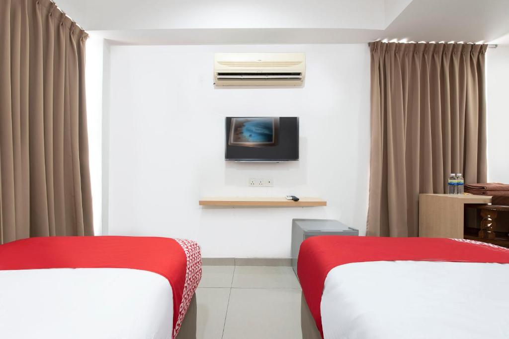 Postel nebo postele na pokoji v ubytování Sg Rengit City Resort 3