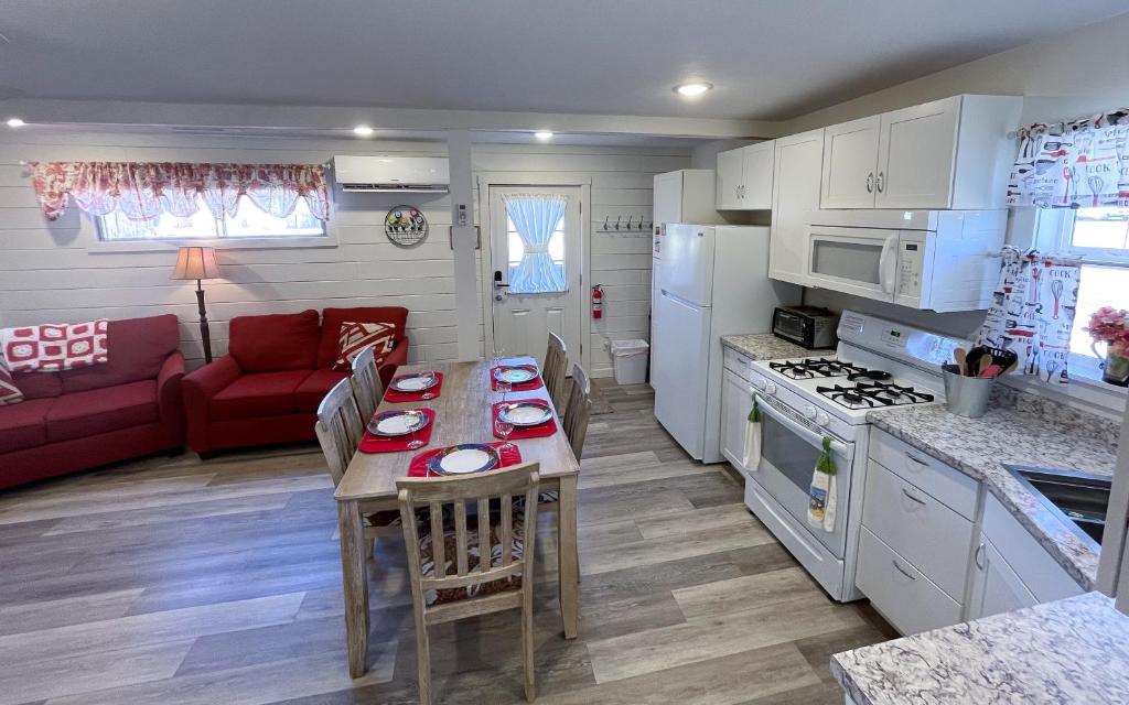 a kitchen and living room with a table and a couch at Kanab Vacation Destination in Kanab