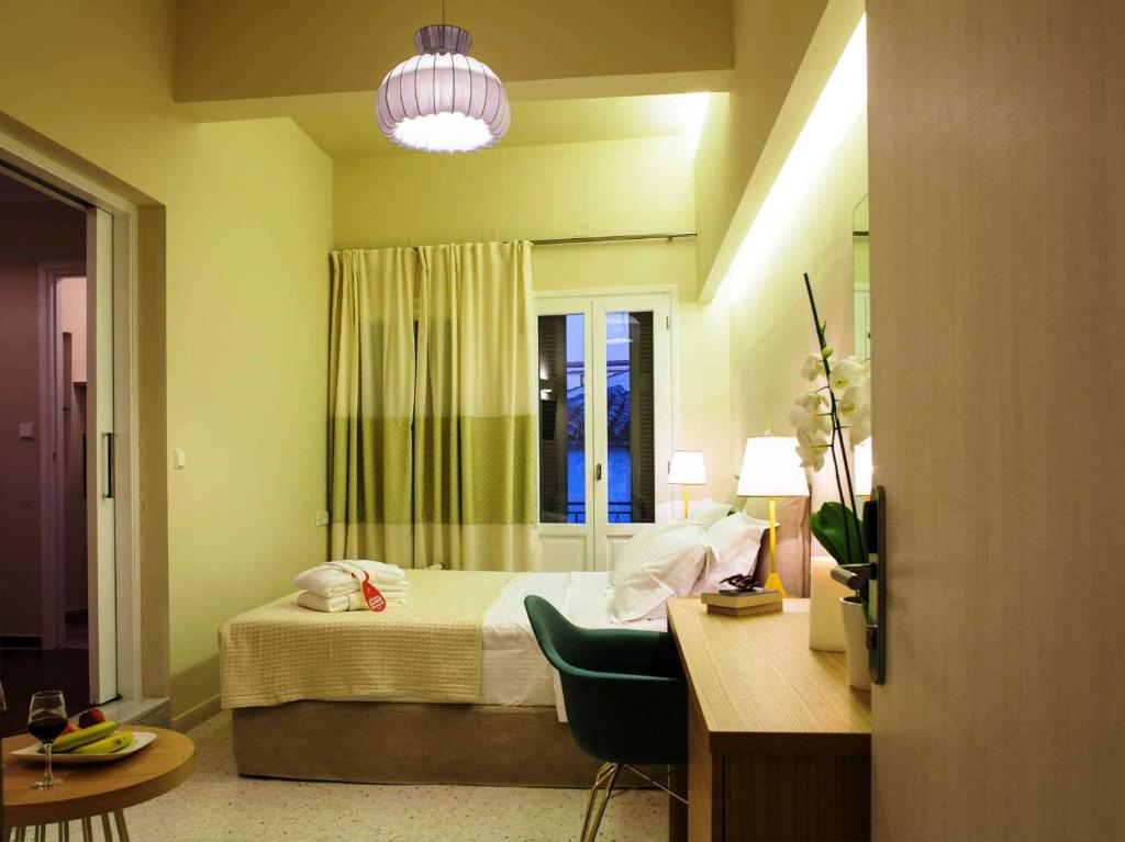 Postel nebo postele na pokoji v ubytování Athena hotel