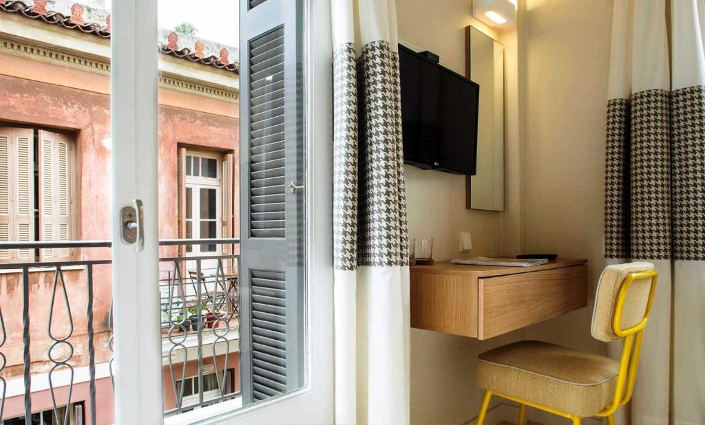 TV a/nebo společenská místnost v ubytování Athena hotel