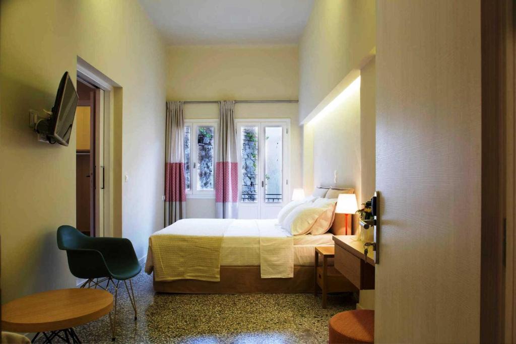 Postel nebo postele na pokoji v ubytování Athena hotel