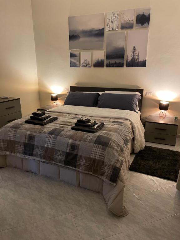 Postel nebo postele na pokoji v ubytování Civita Home Experience
