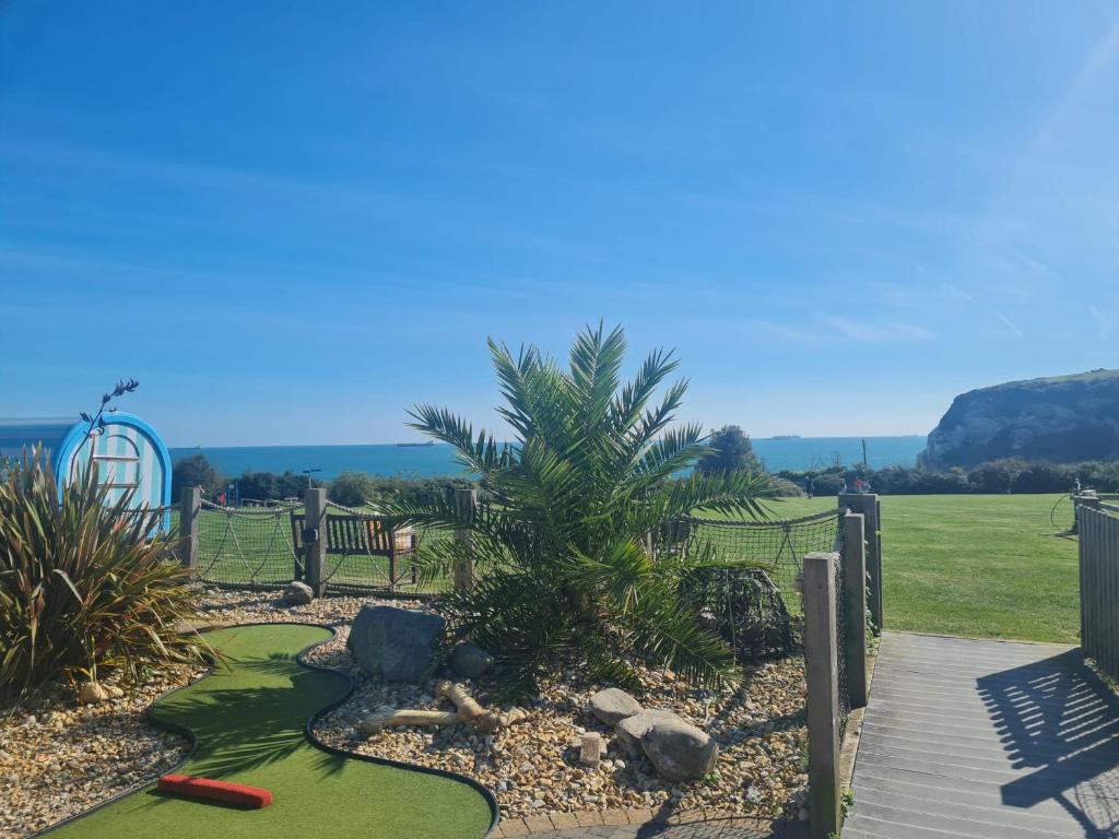 a miniature golf course at a resort with a playground at Luxurious Lodging in Bembridge in Bembridge