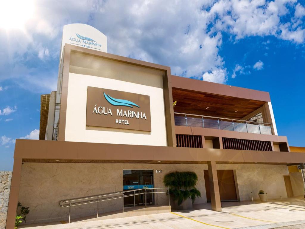 a building with aania sign on the side of it at Hotel Agua Marinha in Natal