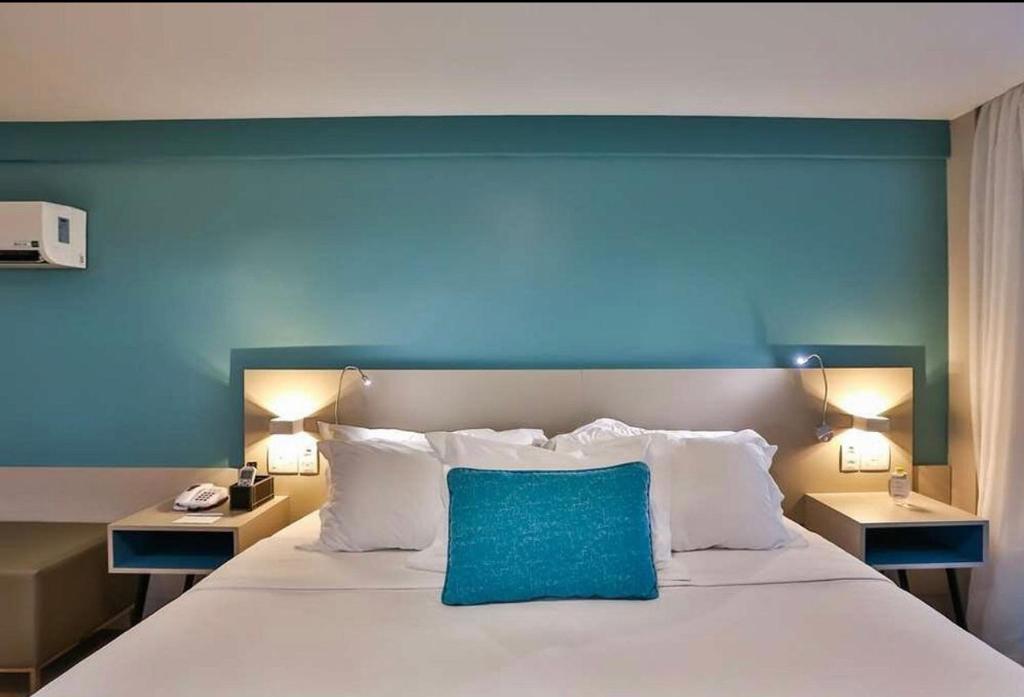 Postel nebo postele na pokoji v ubytování Radisson Hotel luxo ap 801