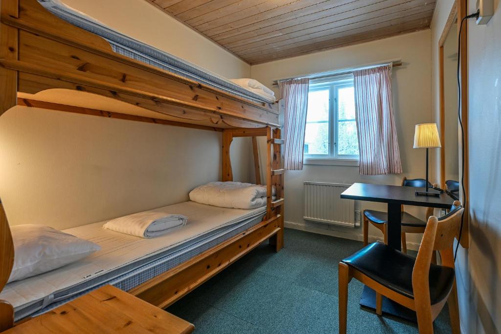 Postel nebo postele na pokoji v ubytování Försgården Fjällpensionat