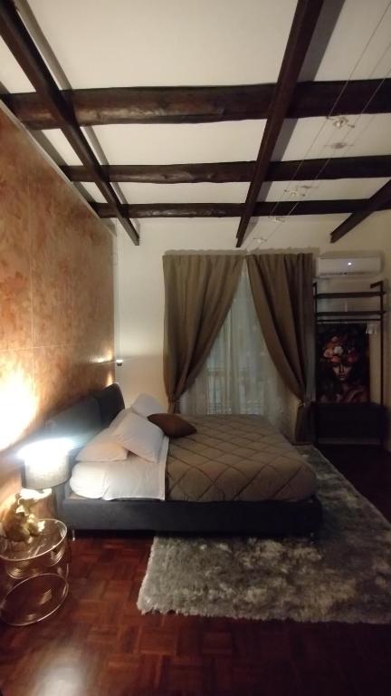 Postel nebo postele na pokoji v ubytování Plebiscito Suite Apartment