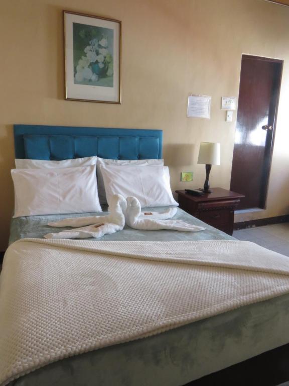 Postel nebo postele na pokoji v ubytování Hotel Tahami