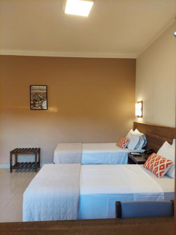 Postel nebo postele na pokoji v ubytování Hotel Pousada Santa Rita
