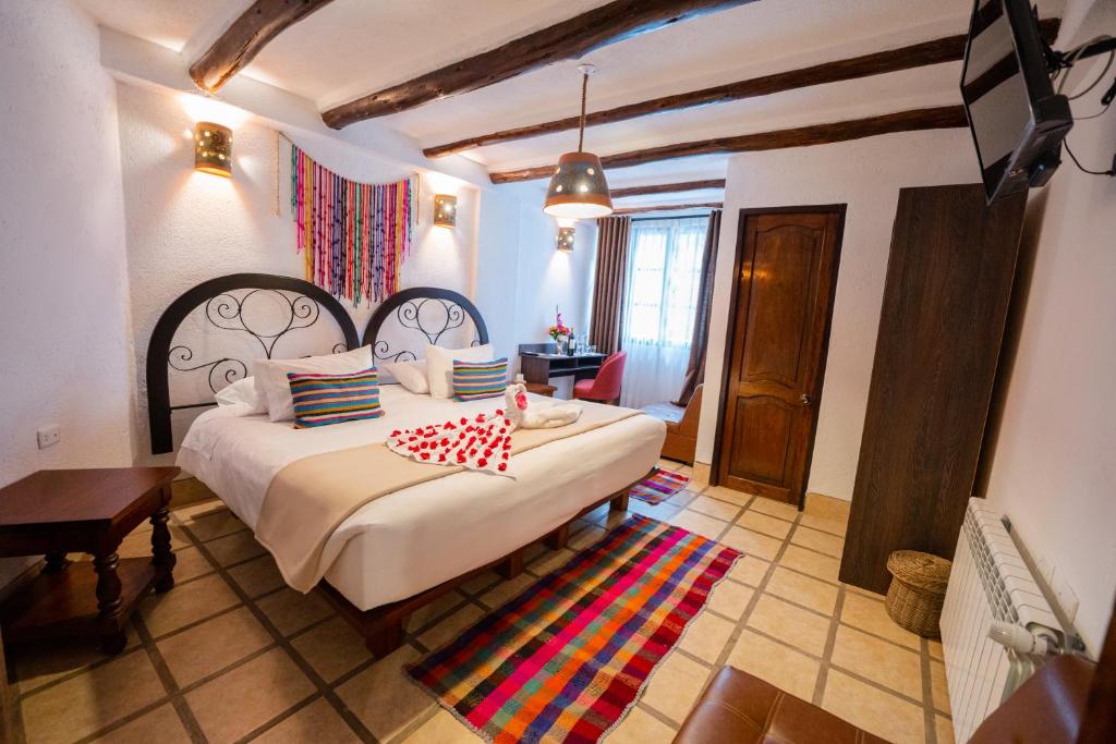 Postel nebo postele na pokoji v ubytování Vilas Insight Hotel Machupicchu