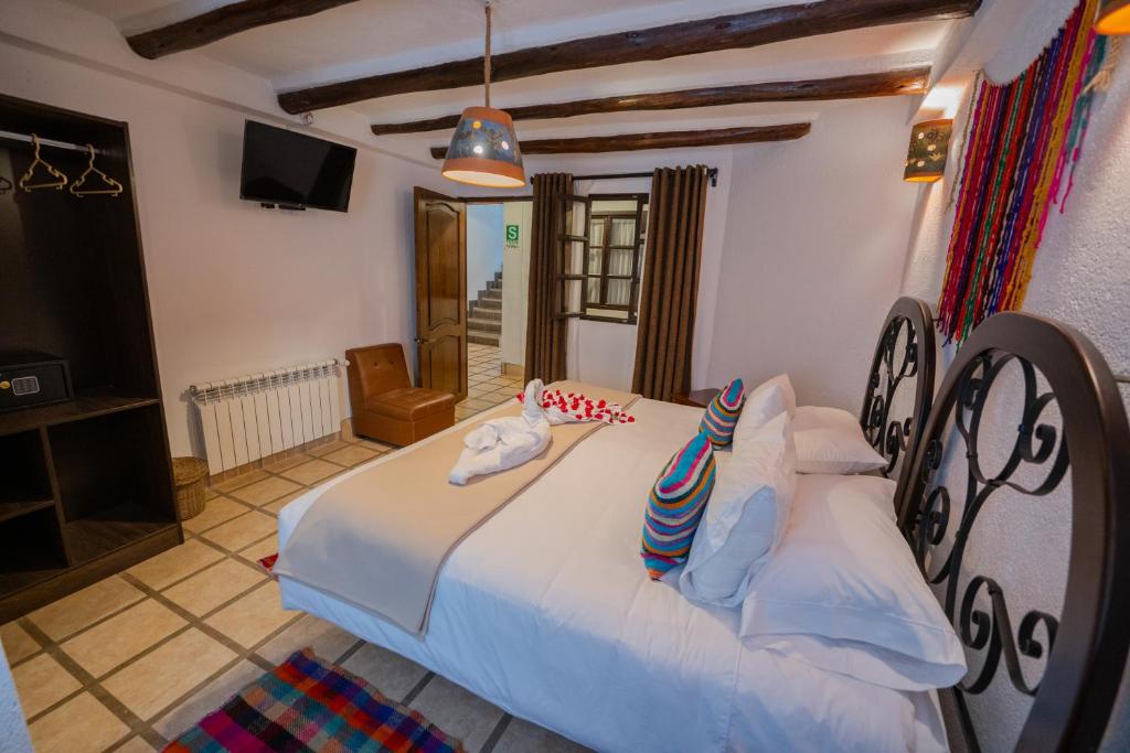 Postel nebo postele na pokoji v ubytování Vilas Insight Hotel Machupicchu