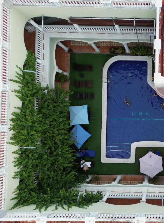a model of a house with a tree and a swimming pool at Hotel Real La Merced in Granada