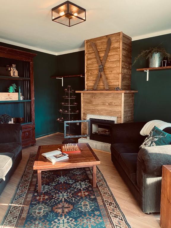 a living room with a couch and a fireplace at Refúgio do Mezio in Mezio