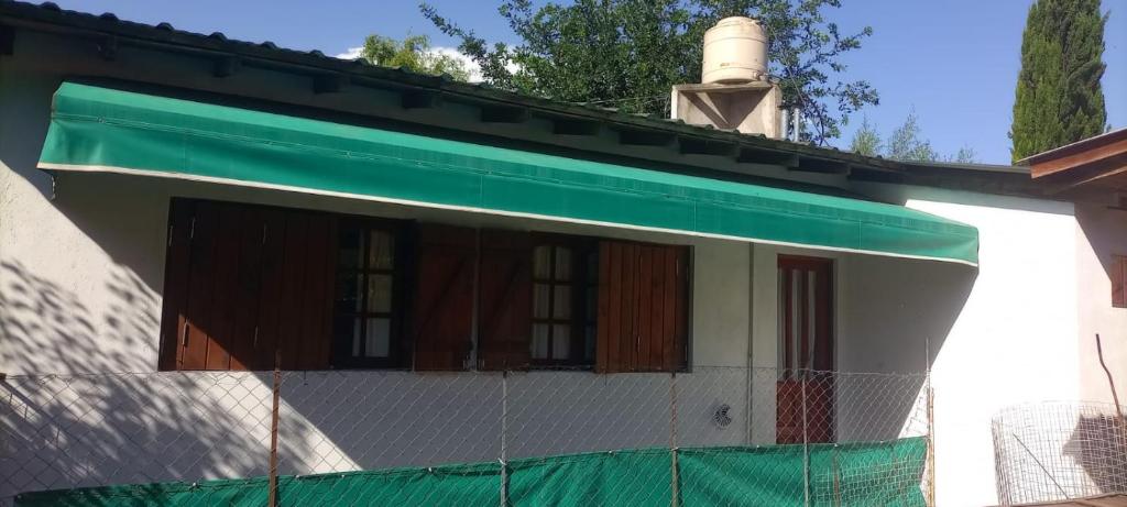 a house with a fence in front of it at Departamento MDP (Para 4 personas Maximo) in Mar del Plata