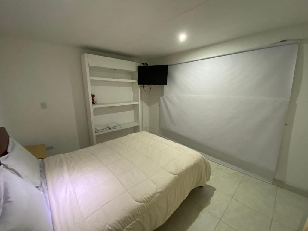 Postel nebo postele na pokoji v ubytování Stay In Bogota