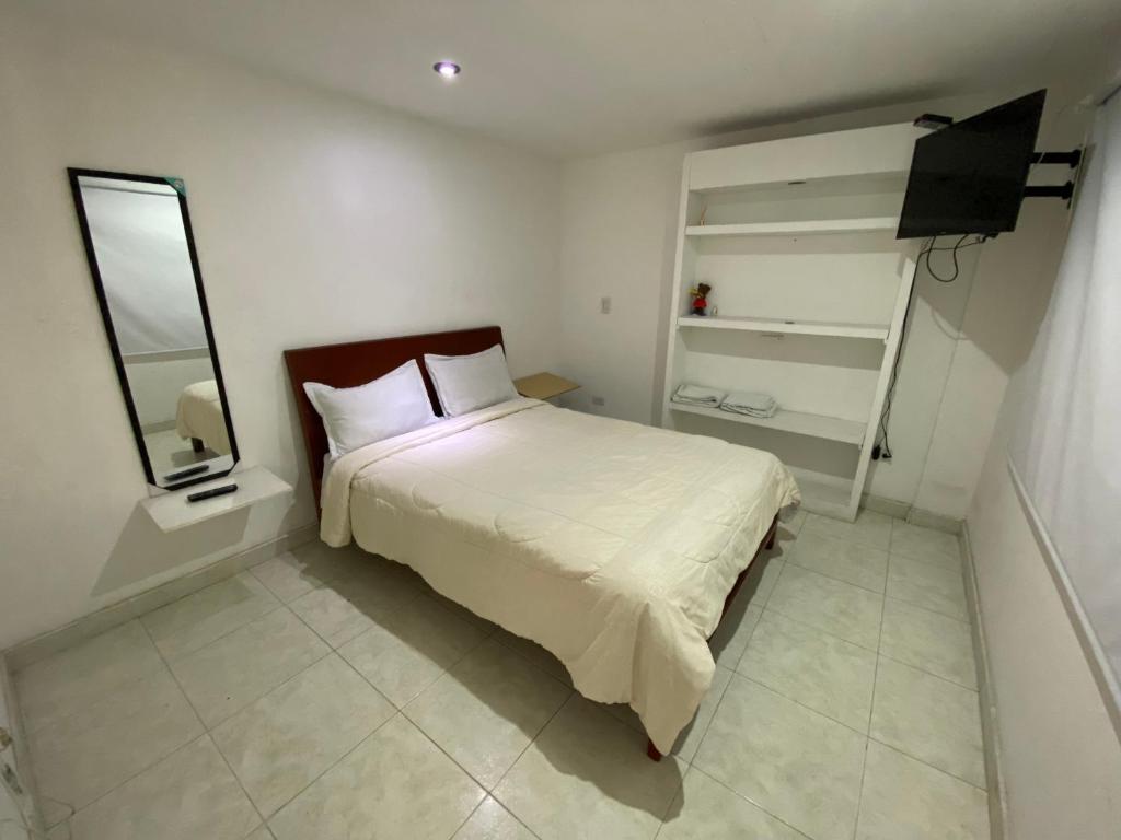 Postel nebo postele na pokoji v ubytování Stay In Bogota