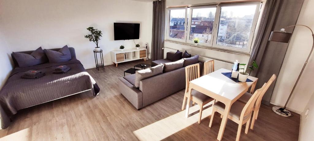a living room with a couch and a table at Apartment Horizont in Bad Sachsa