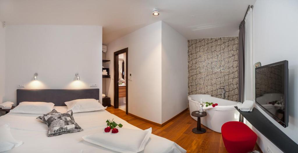 Posteľ alebo postele v izbe v ubytovaní Alba Residence