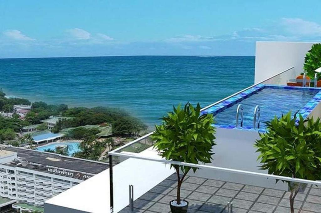 a view of the ocean from the balcony of a building at Pratamnak Pattaya Luxury Condo, Golf, Ocean View in Pattaya South