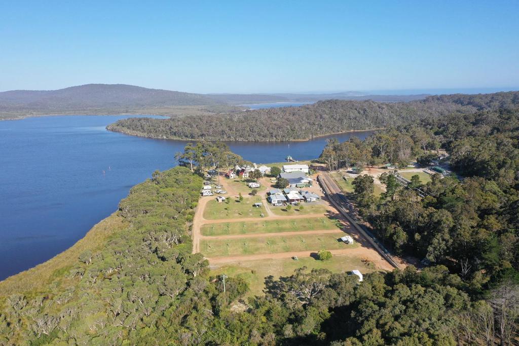 an aerial view of a farm on a island in the water at Walpole Rest Point Caravan Park in Walpole