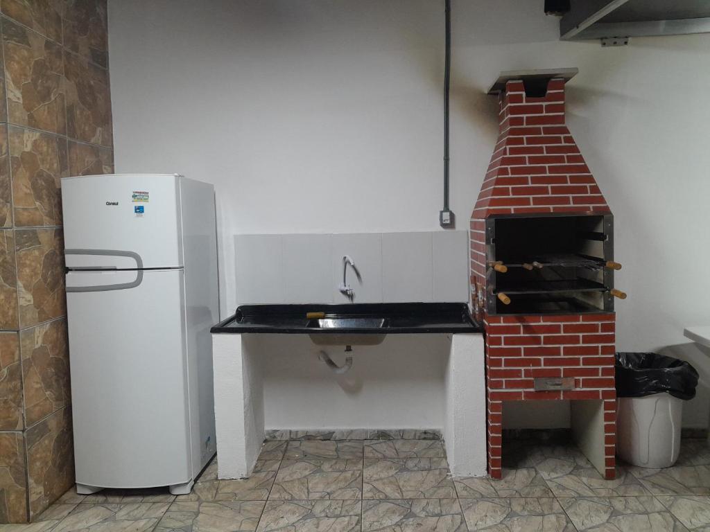 Kuchyň nebo kuchyňský kout v ubytování Pé na areia Casarão do Morcego