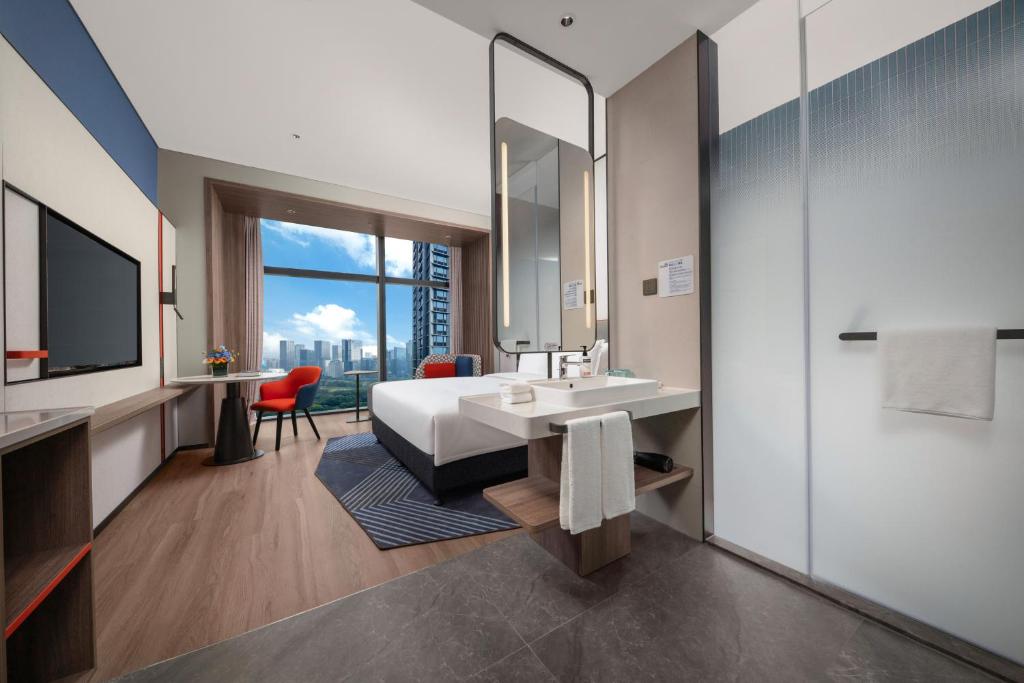 Postel nebo postele na pokoji v ubytování Holiday Inn Express Shenzhen Futian Center by IHG
