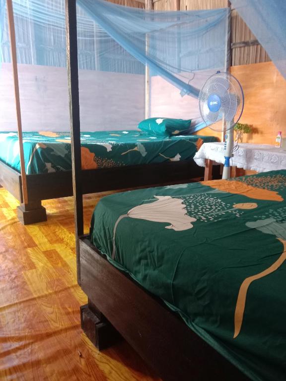 Postel nebo postele na pokoji v ubytování Amfriwen Homestay