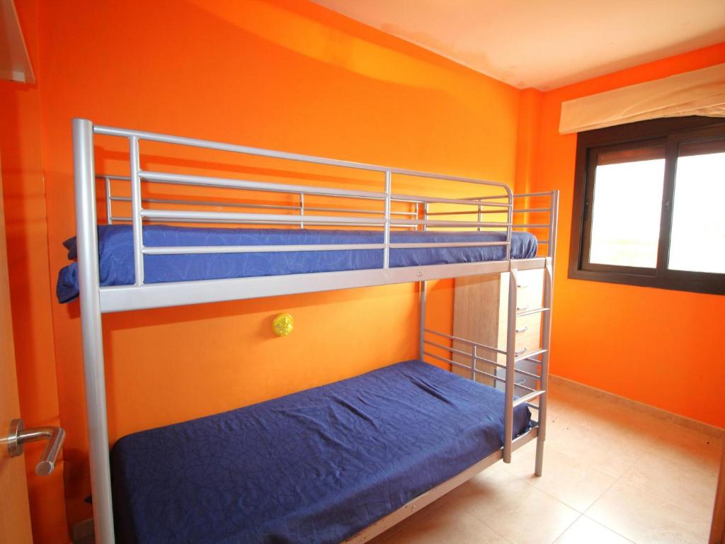 Posteľ alebo postele v izbe v ubytovaní SANT JORDI - Apartamento con vistas la montaña, piscina comunitaria y garaje. - ES-228-44