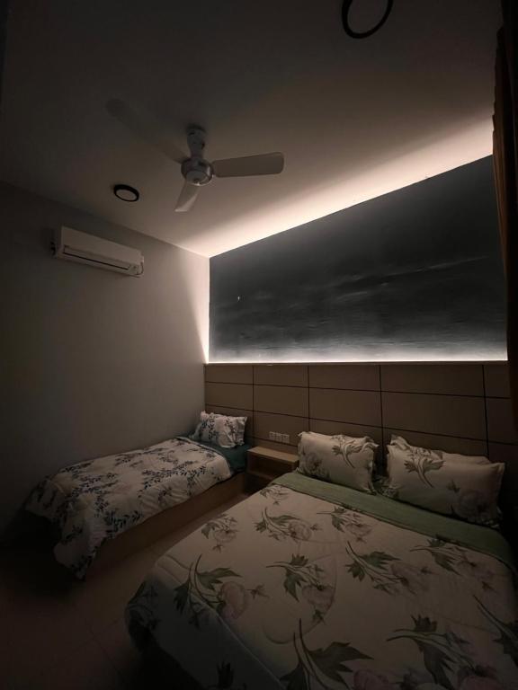 Ένα ή περισσότερα κρεβάτια σε δωμάτιο στο MV Suite Homestay