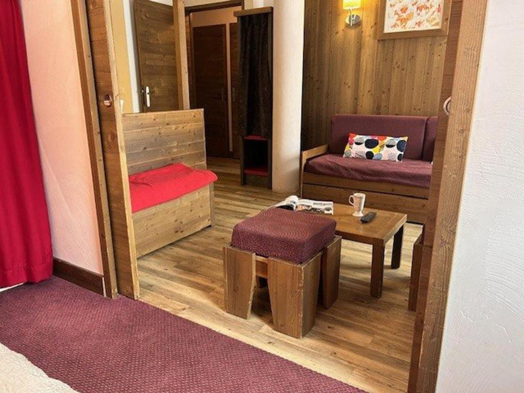 a room with a mirror and a table and a chair at Appartement Risoul, 2 pièces, 4 personnes - FR-1-330-569 in Risoul