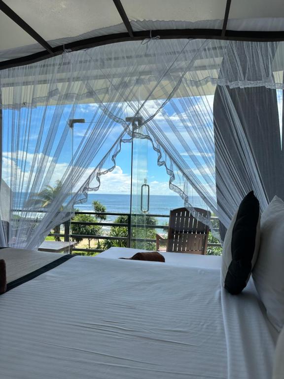 Postel nebo postele na pokoji v ubytování Mirissa Gate Resort