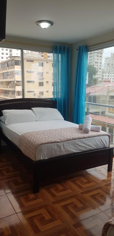 En eller flere senger på et rom på Hostal Costa Linda Salinas