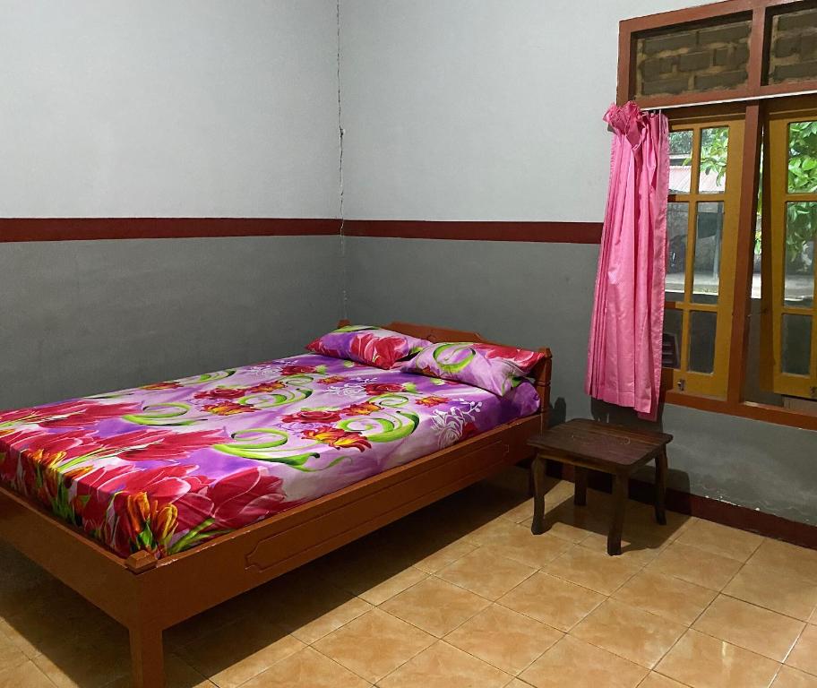 เตียงในห้องที่ OYO 93632 Ramasta Homestay