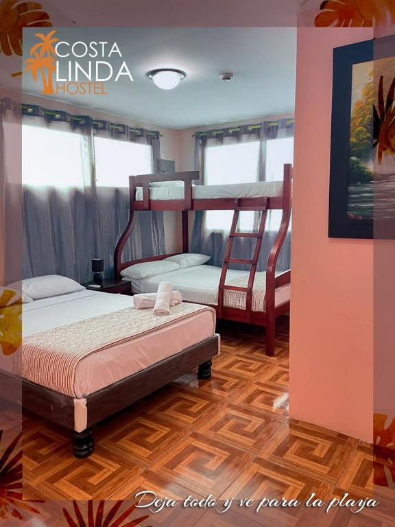 Postel nebo postele na pokoji v ubytování Hostal Costa Linda Salinas