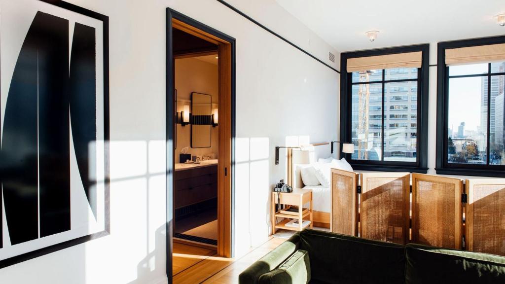 a room with a view of a bedroom with a bed at Shinola Hotel in Detroit