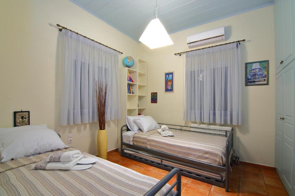 Postel nebo postele na pokoji v ubytování Villa Spilies Kythira