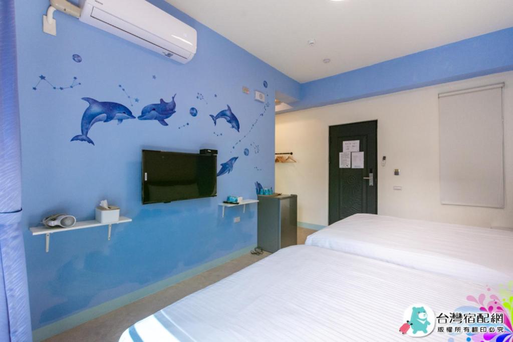 Postel nebo postele na pokoji v ubytování Baby Dolphin