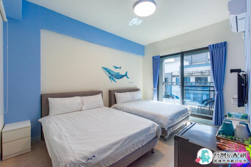 Postel nebo postele na pokoji v ubytování Baby Dolphin