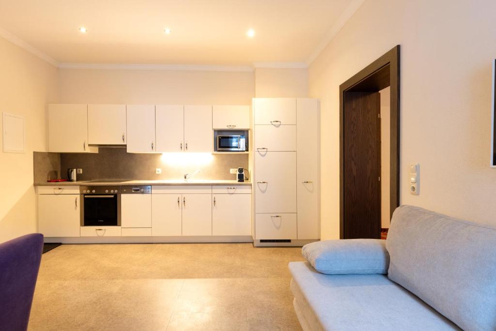 Kuchyň nebo kuchyňský kout v ubytování Appartements Feroli