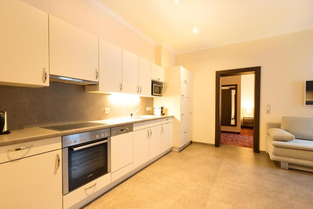 Kuchyň nebo kuchyňský kout v ubytování Appartements Feroli