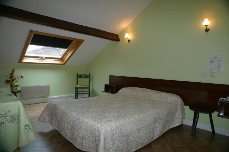 Postel nebo postele na pokoji v ubytování Garabit Hotel