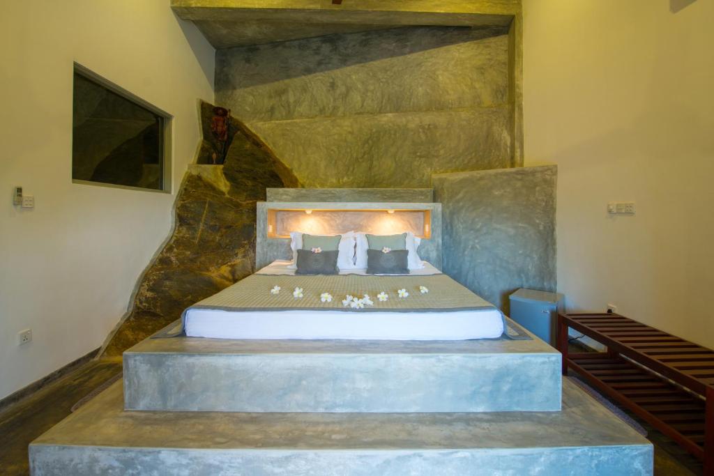 a bedroom with a large bed in a room at The Horizon Hill Top Villa in Unawatuna