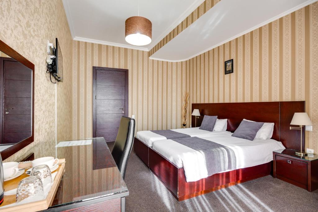 Postel nebo postele na pokoji v ubytování Sololaki Inn
