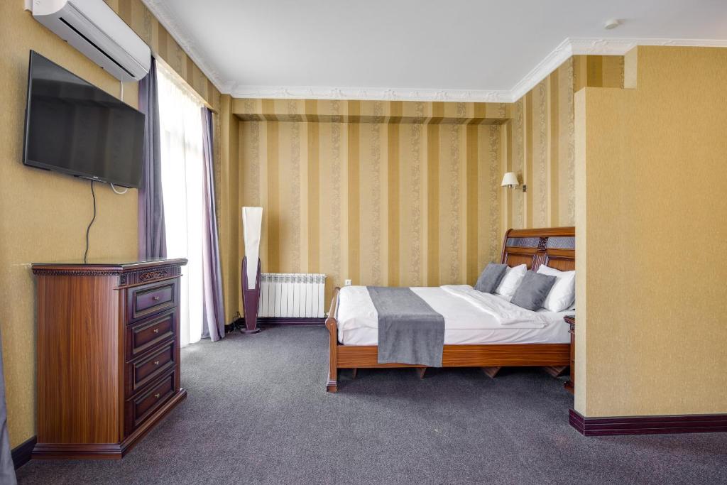 Postel nebo postele na pokoji v ubytování Sololaki Inn